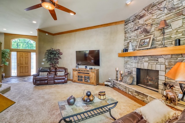 21005 County Highway 32, Rochert, MN 56578 - carpeted living area with crown molding, a stone fireplace, a ceiling fan, and recessed lighting