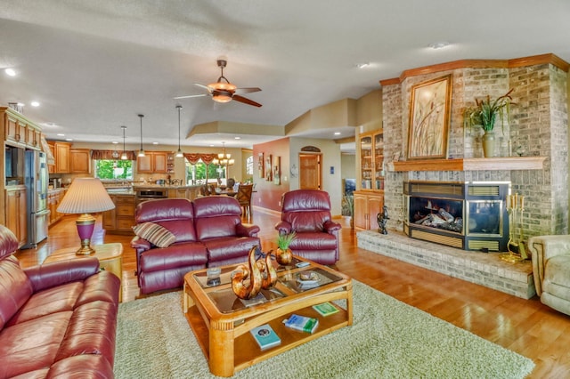 21005 County Highway 32, Rochert, MN 56578 - living area featuring light wood-style flooring, a ceiling fan, recessed lighting, a fireplace, and baseboards