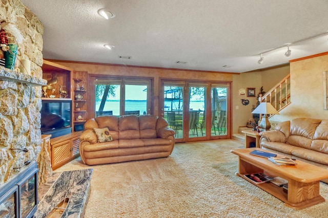21005 County Highway 32, Rochert, MN 56578 - living room with a fireplace, carpet flooring, a textured ceiling, ornamental molding, and stairs