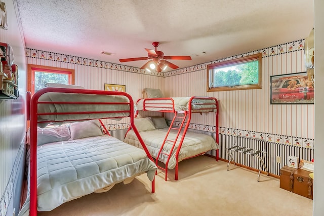 21005 County Highway 32, Rochert, MN 56578 - bedroom featuring wallpapered walls, a textured ceiling, carpet floors, and ceiling fan