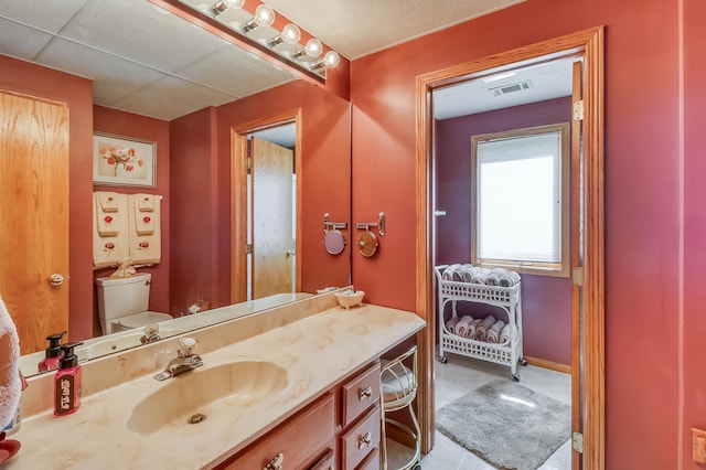 21005 County Highway 32, Rochert, MN 56578 - bathroom featuring toilet, vanity, and tile patterned floors