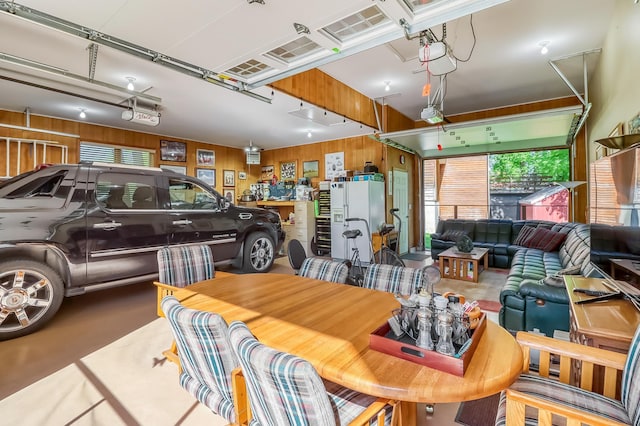 21005 County Highway 32, Rochert, MN 56578 - garage with a garage door opener and wooden walls