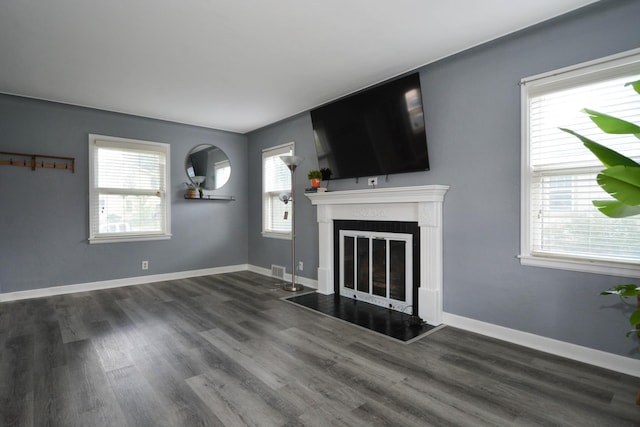 75 Geranium Ave E, Saint Paul, MN 55117 - unfurnished living room featuring wood finished floors and a glass covered fireplace