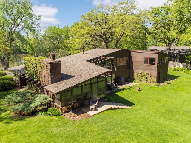 4618 Cedarwood Rd, Saint Louis Park, MN 55416 - rear view of property with a yard and a sunroom