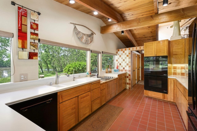 4618 Cedarwood Rd, Saint Louis Park, MN 55416 - kitchen featuring a sink, wood ceiling, black appliances, tile patterned floors, and light countertops