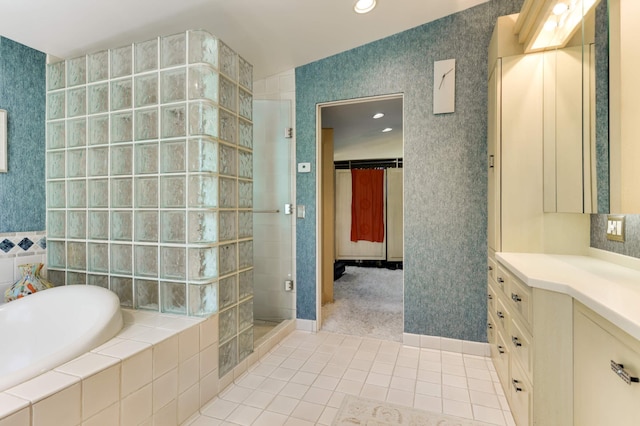 4618 Cedarwood Rd, Saint Louis Park, MN 55416 - full bathroom with vanity, a tile shower, a bath, tile patterned floors, and wallpapered walls
