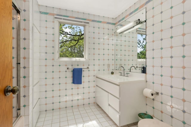 4618 Cedarwood Rd, Saint Louis Park, MN 55416 - full bath with tile walls, vanity, tile patterned flooring, and toilet