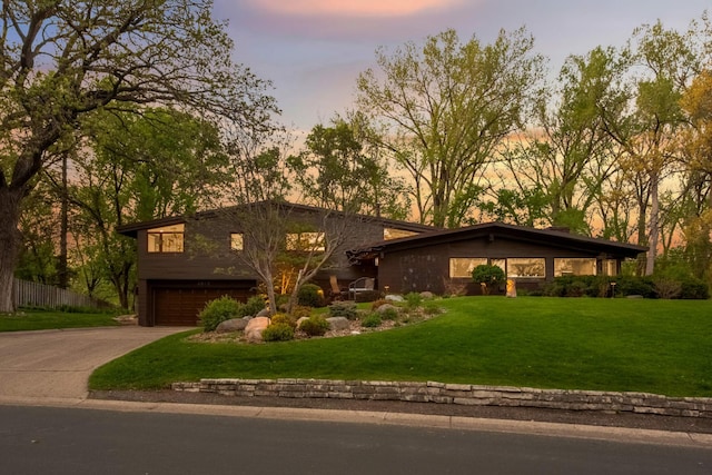 4618 Cedarwood Rd, Saint Louis Park, MN 55416 - mid-century modern home with a garage, a front lawn, and concrete driveway