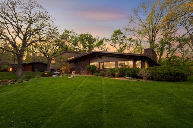 4618 Cedarwood Rd, Saint Louis Park, MN 55416 - view of front of house featuring a chimney and a lawn