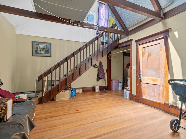 3213 Minnehaha Ave, Minneapolis, MN 55406 - stairs featuring wood-type flooring and a baseboard heating unit