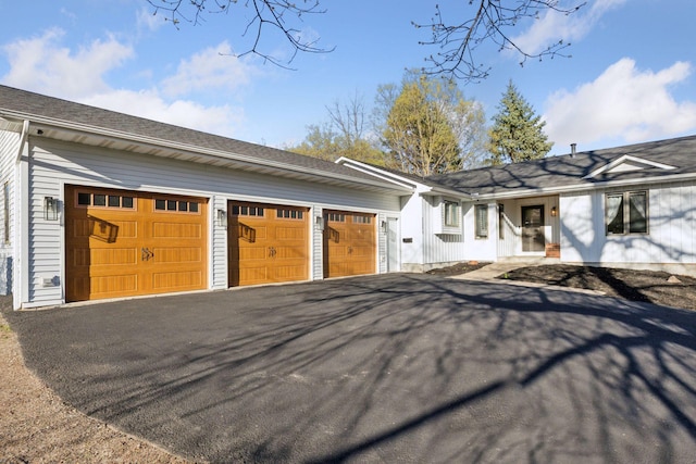 view of front of property with aphalt driveway