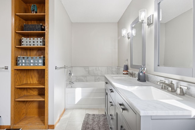 bathroom featuring double vanity, a sink, tile patterned flooring, and a garden tub