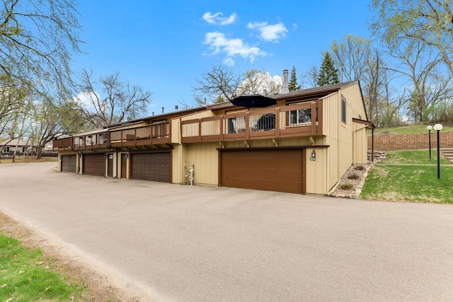 view of front of house with a garage and aphalt driveway