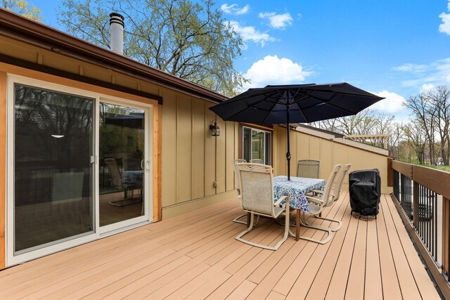 wooden deck with outdoor dining space