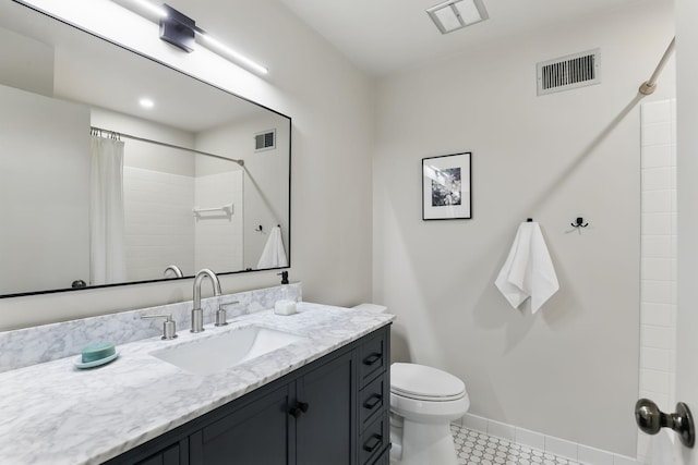 bathroom featuring vanity, toilet, curtained shower, and visible vents