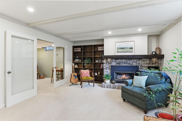 living area featuring a brick fireplace, carpet floors, recessed lighting, baseboards, and beamed ceiling