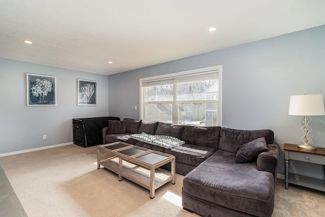 living room with light colored carpet, recessed lighting, and baseboards