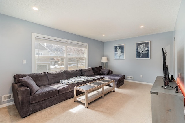 living room featuring baseboards, light carpet, recessed lighting, and visible vents