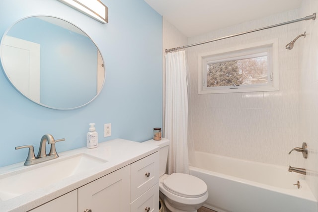 bathroom featuring vanity, shower / bathtub combination with curtain, and toilet