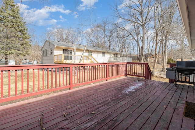 wooden terrace with area for grilling