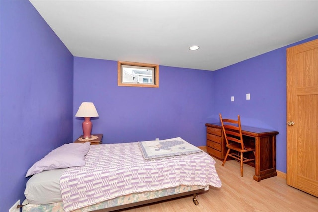 bedroom featuring recessed lighting, baseboards, and wood finished floors