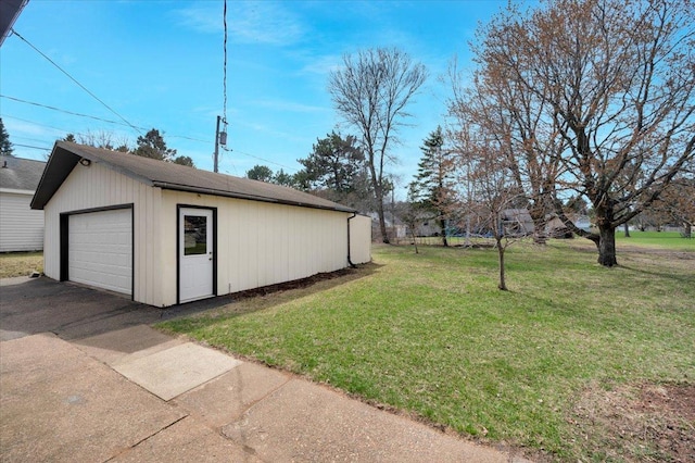 detached garage featuring driveway