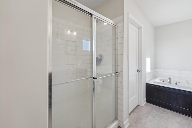 18357 Glacier Way, Lakeville, MN 55044 - full bathroom featuring tile patterned floors, a shower stall, a bath, and a wealth of natural light