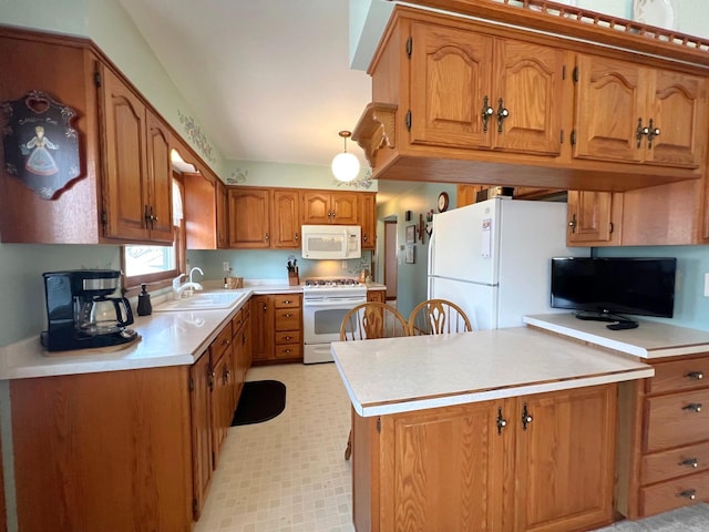 kitchen with white appliances, a sink, brown cabinets, light countertops, and light floors