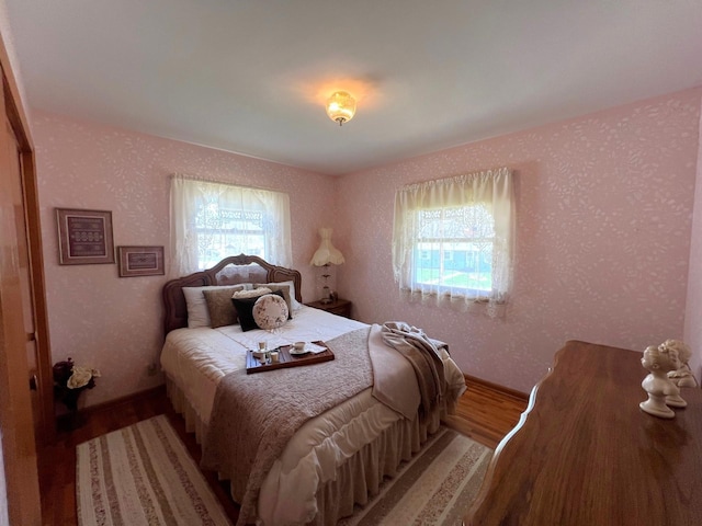 bedroom with wood finished floors