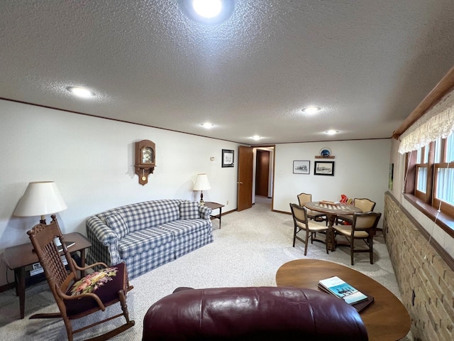 carpeted living room with a textured ceiling and recessed lighting