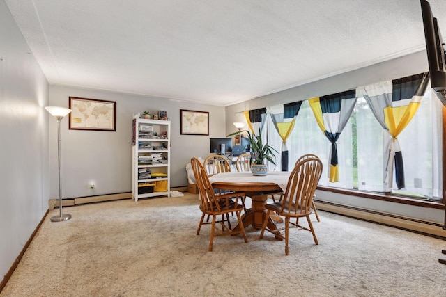 dining space with a textured ceiling, baseboards, a baseboard radiator, a baseboard heating unit, and carpet flooring