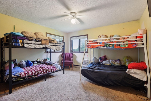 carpeted bedroom with a textured ceiling and ceiling fan