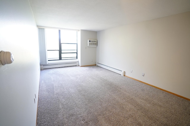 spare room featuring a wall mounted AC, a baseboard radiator, carpet, and baseboards