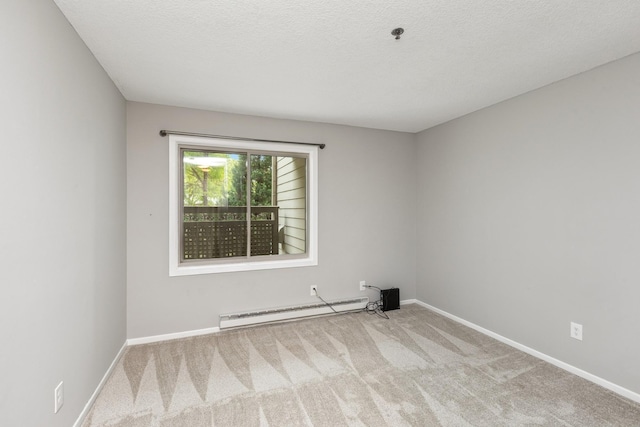 2110 Ridge Dr Unit 11, Saint Louis Park, MN 55416 - empty room with a baseboard heating unit, carpet floors, baseboards, and a textured ceiling