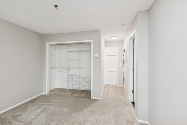 2110 Ridge Dr Unit 11, Saint Louis Park, MN 55416 - unfurnished bedroom featuring carpet, a closet, and baseboards
