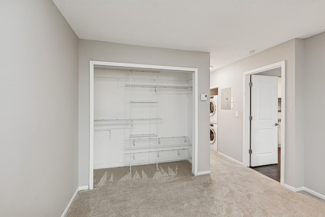 2110 Ridge Dr Unit 11, Saint Louis Park, MN 55416 - spacious closet featuring stacked washer / dryer and carpet