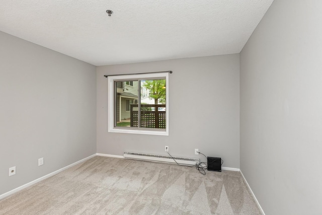 2110 Ridge Dr Unit 11, Saint Louis Park, MN 55416 - carpeted spare room with a baseboard radiator, baseboards, a textured ceiling, and fire sprinkler in ceiling