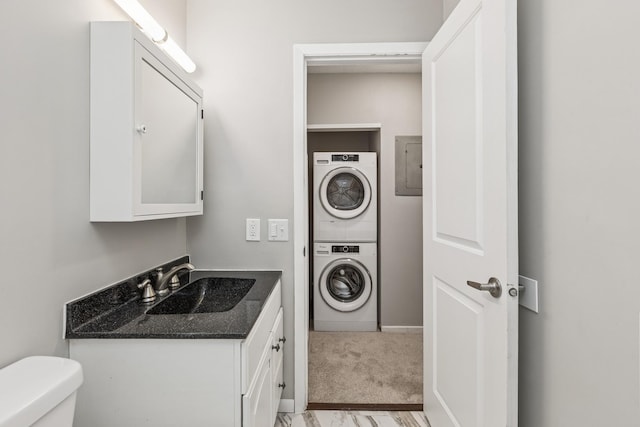 2110 Ridge Dr Unit 11, Saint Louis Park, MN 55416 - washroom with stacked washer / drying machine, light carpet, and electric panel