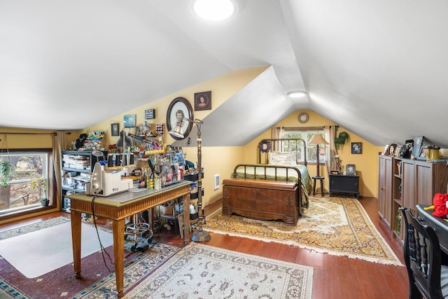 bedroom featuring vaulted ceiling and wood finished floors