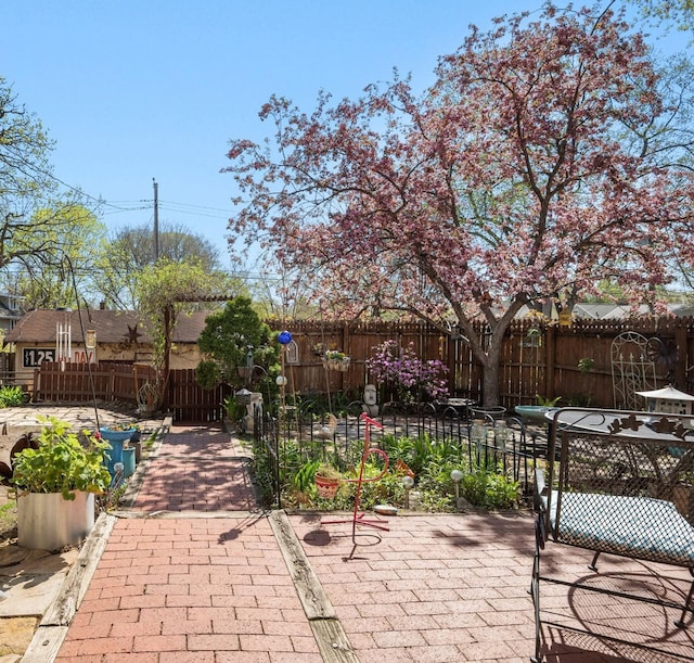 view of patio featuring fence
