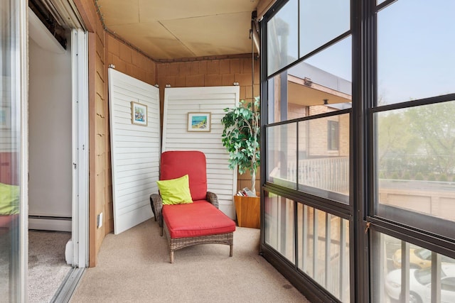 sunroom / solarium with baseboard heating and a wealth of natural light