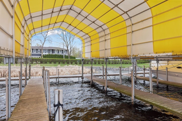 view of dock featuring a water view and boat lift