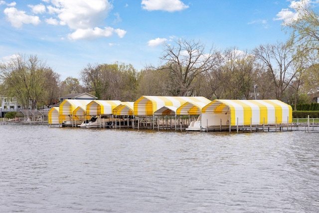 exterior space featuring a water view and a dock