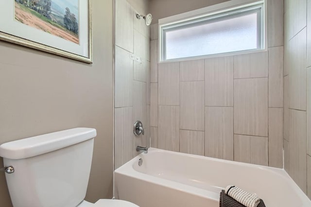 bathroom featuring toilet and shower / bathtub combination