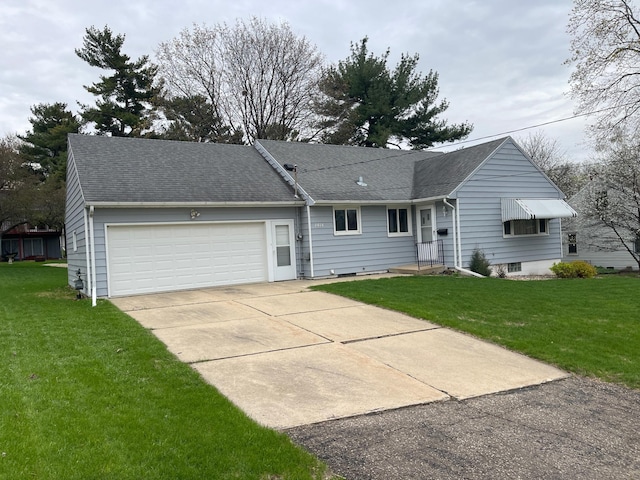 view of front of house with driveway, a front lawn, roof with shingles, and a garage