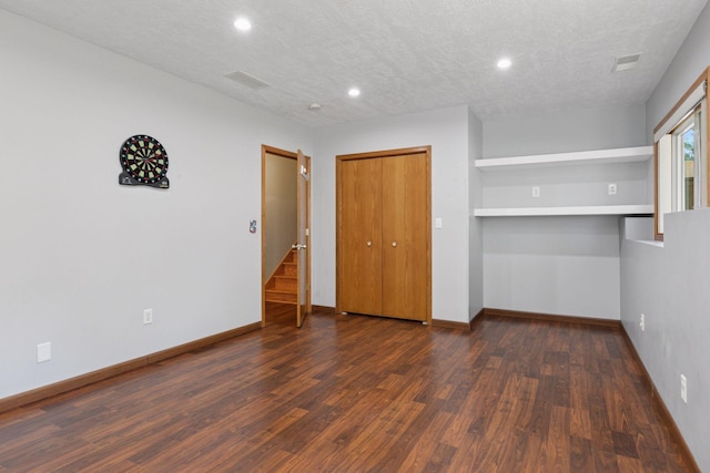 unfurnished bedroom featuring recessed lighting, visible vents, and wood finished floors