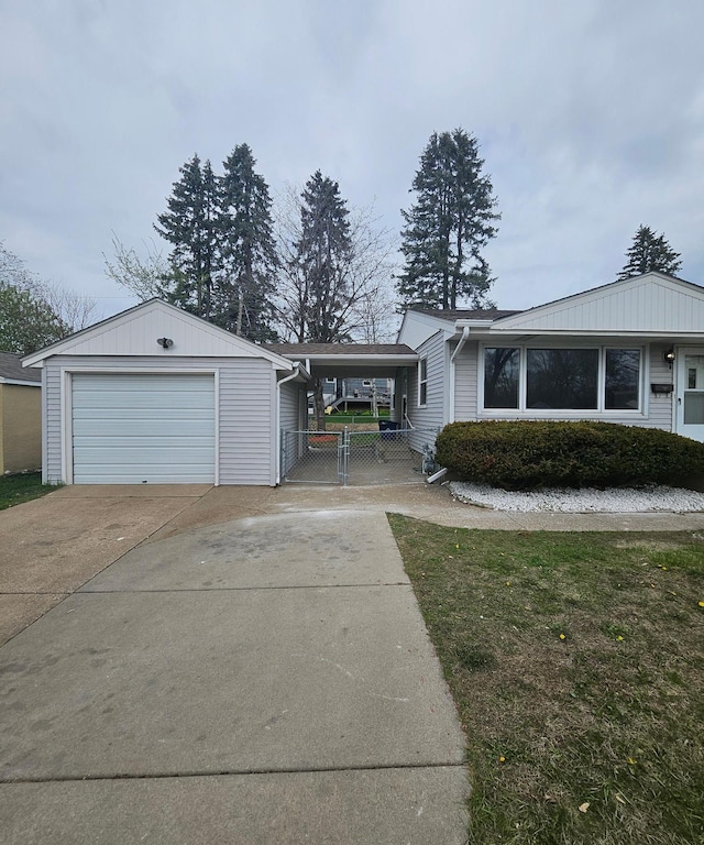 single story home featuring a garage, fence, and driveway