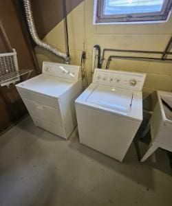 washroom with separate washer and dryer