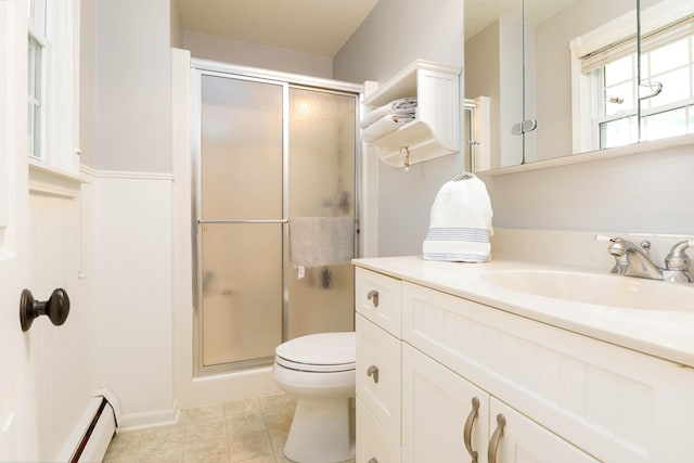 full bath with vanity, baseboard heating, a shower stall, and toilet