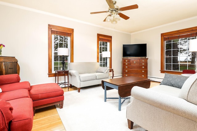 living room featuring crown molding, a ceiling fan, a baseboard radiator, and light wood-type flooring